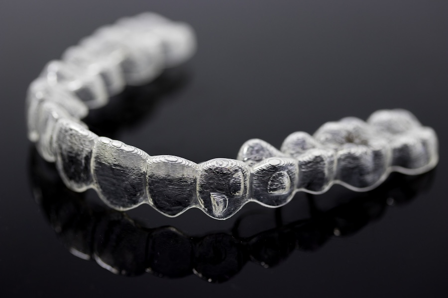 invisalign clear aligners with spaces for attachments, buttons